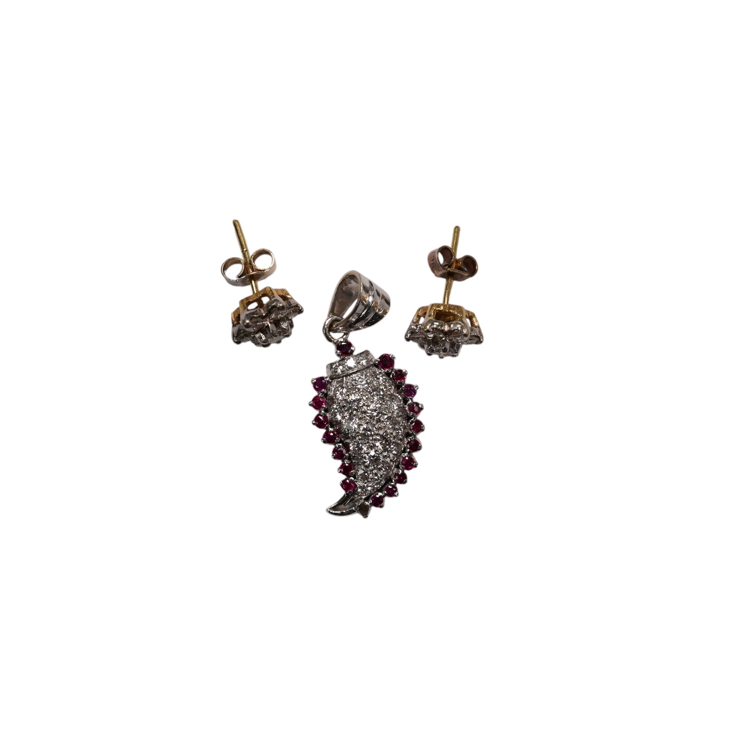 A white metal, diamond and ruby set pendant, 26mm and a pair of 9ct and diamond cluster set ear studs, gross weight 6.1 grams. Condition - fair to good